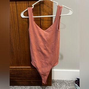 Free People women’s Bodysuit in Blush Pink size XS/S